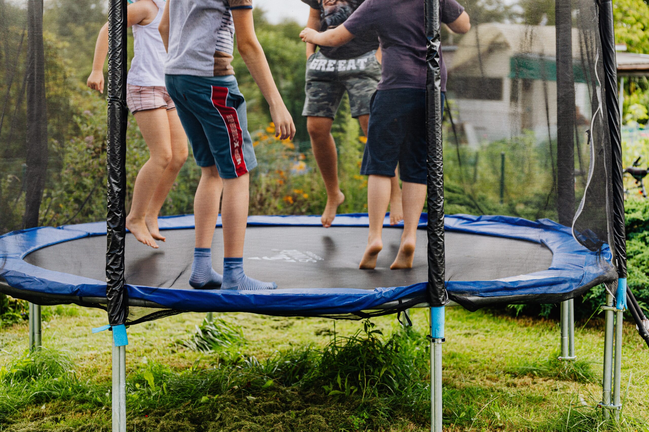 boys jumping on trampoline