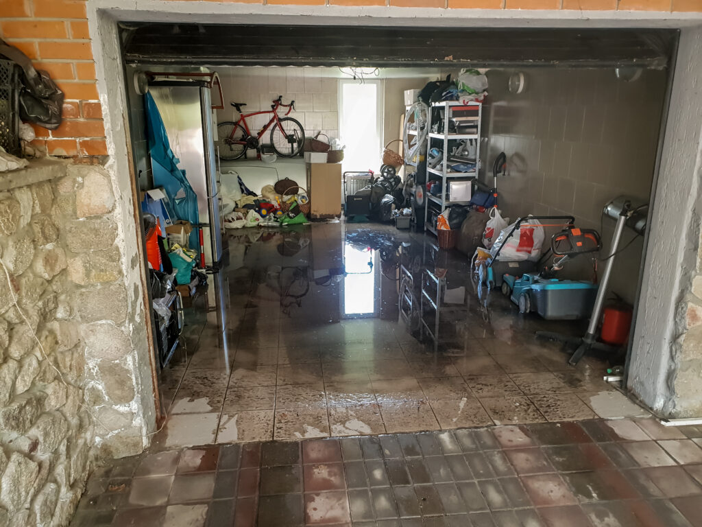 A flooded garage after heavy rain.