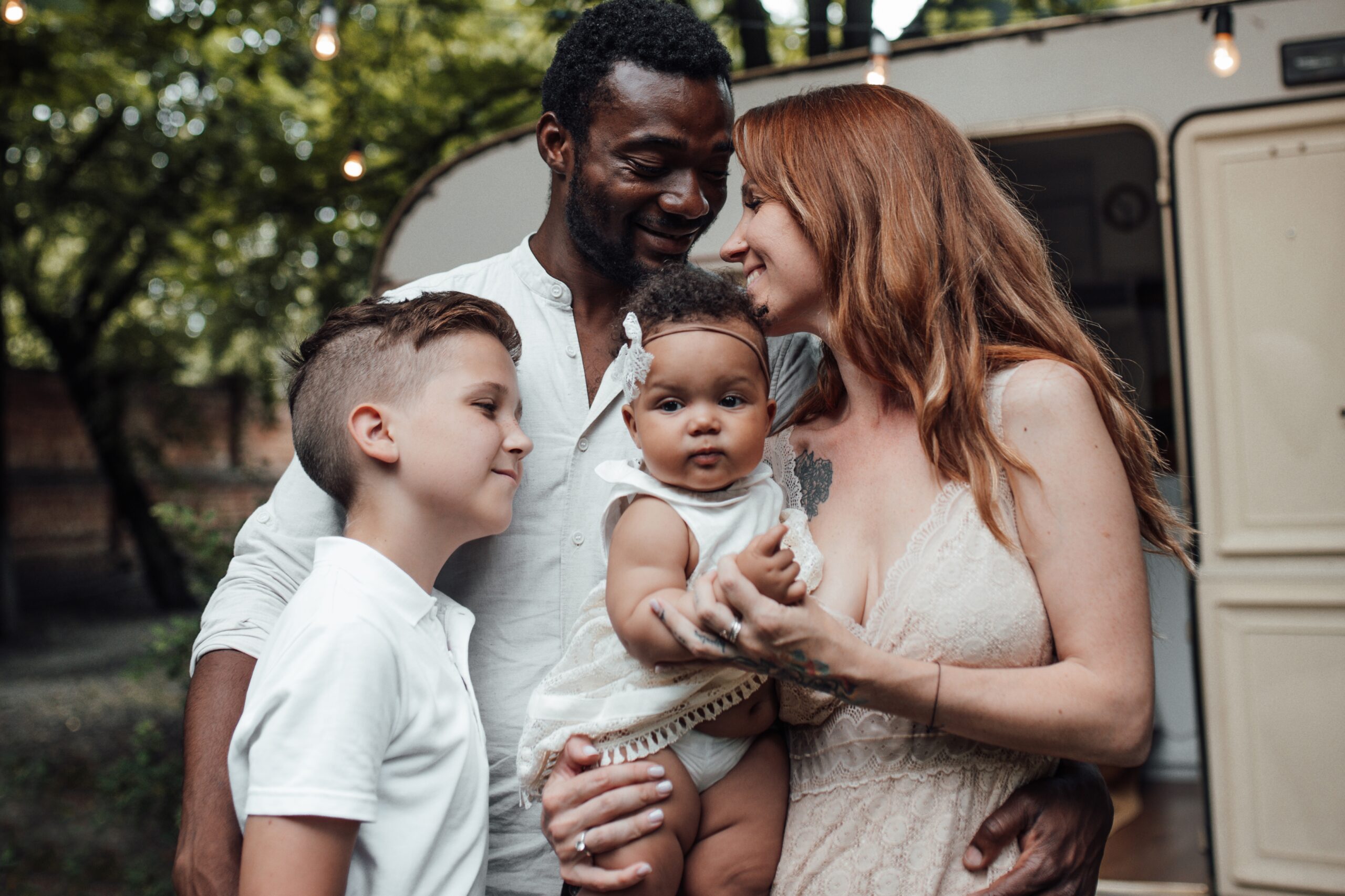 Family outside camper