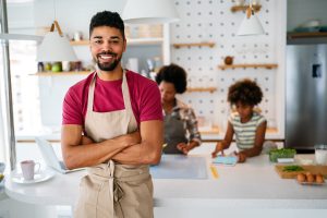 business owner wearing apron in shop