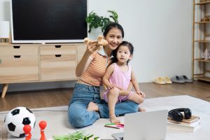 mom playing with child on floor