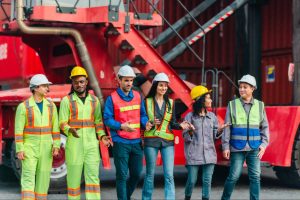construction workers in front of machinery
