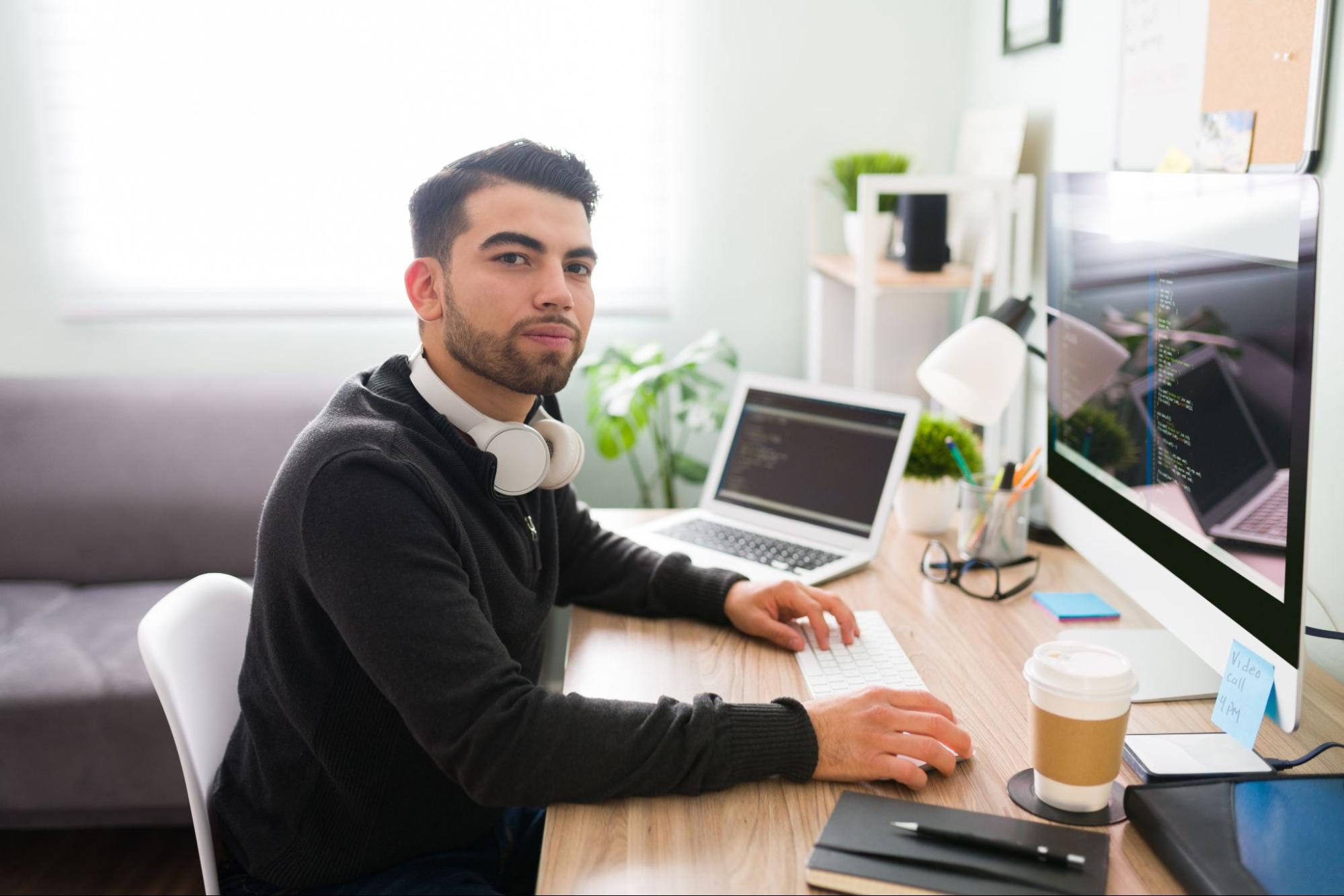 man working at home office desk